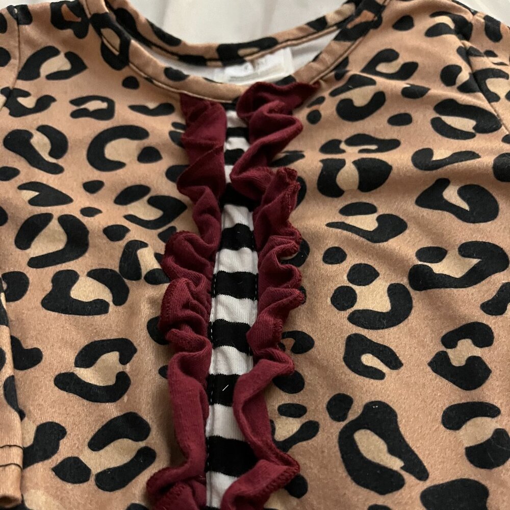 Boutique leopard print ruffle romper.